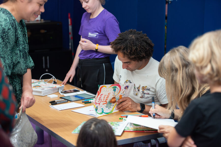 Joseph Coelho and Fiona Lumbers signing books after their event